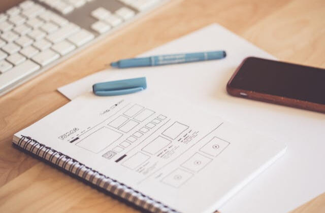 Website wireframe sketching for Minneapolis web design services Notepad with website wireframe sketch, representing web design services in Minneapolis